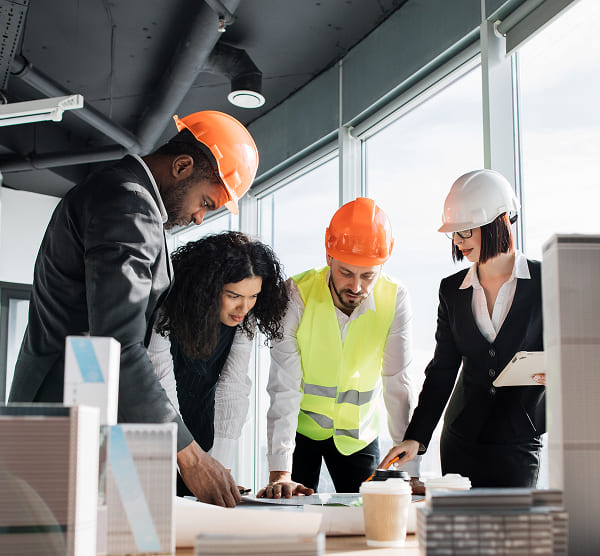 group of four multiracial people architects standi 2024 12 13 08 27 17 utc 1.jpg